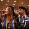 Two PharmD grads in audience at commencement ceremony