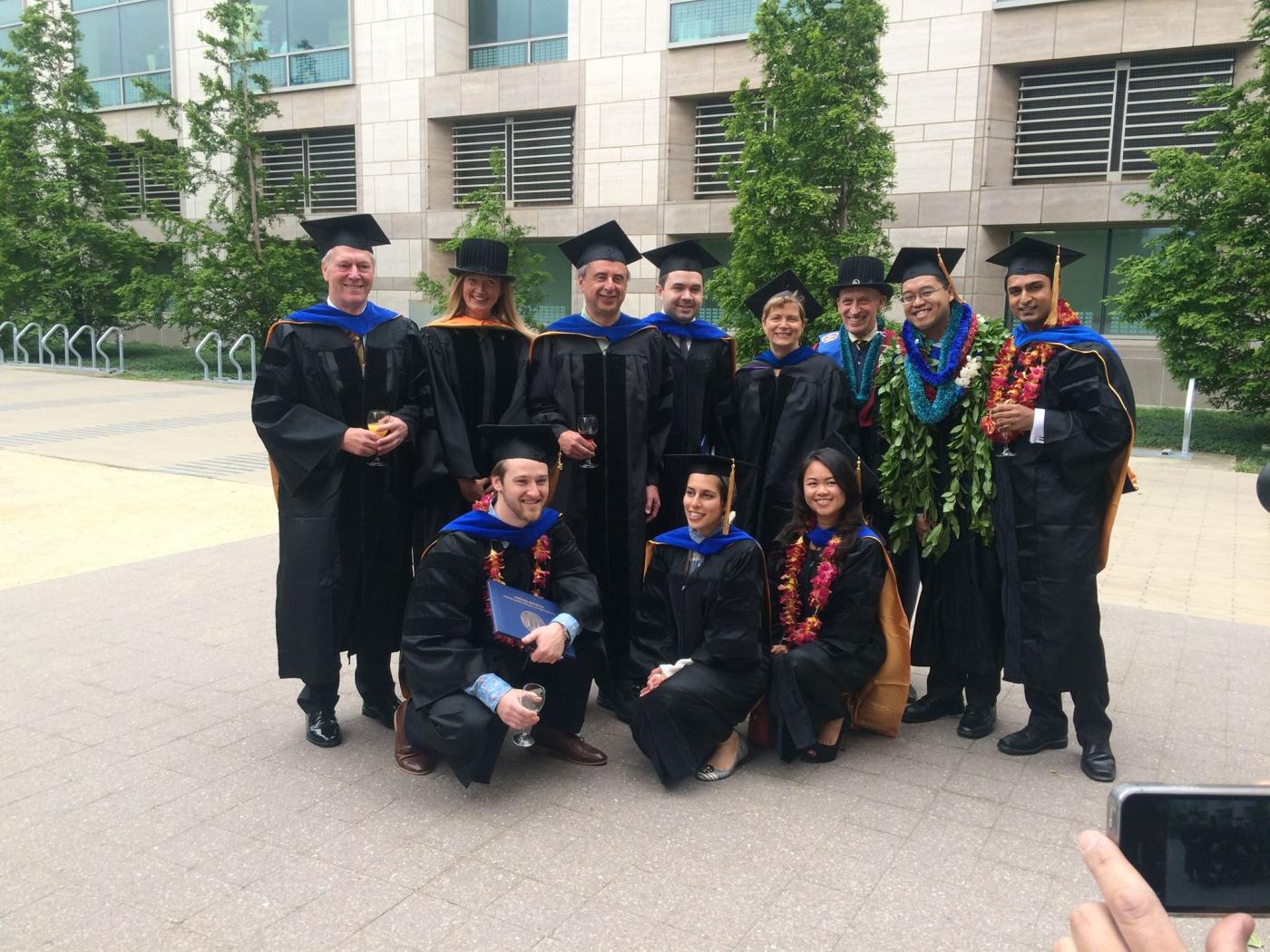 graduates with faculty members